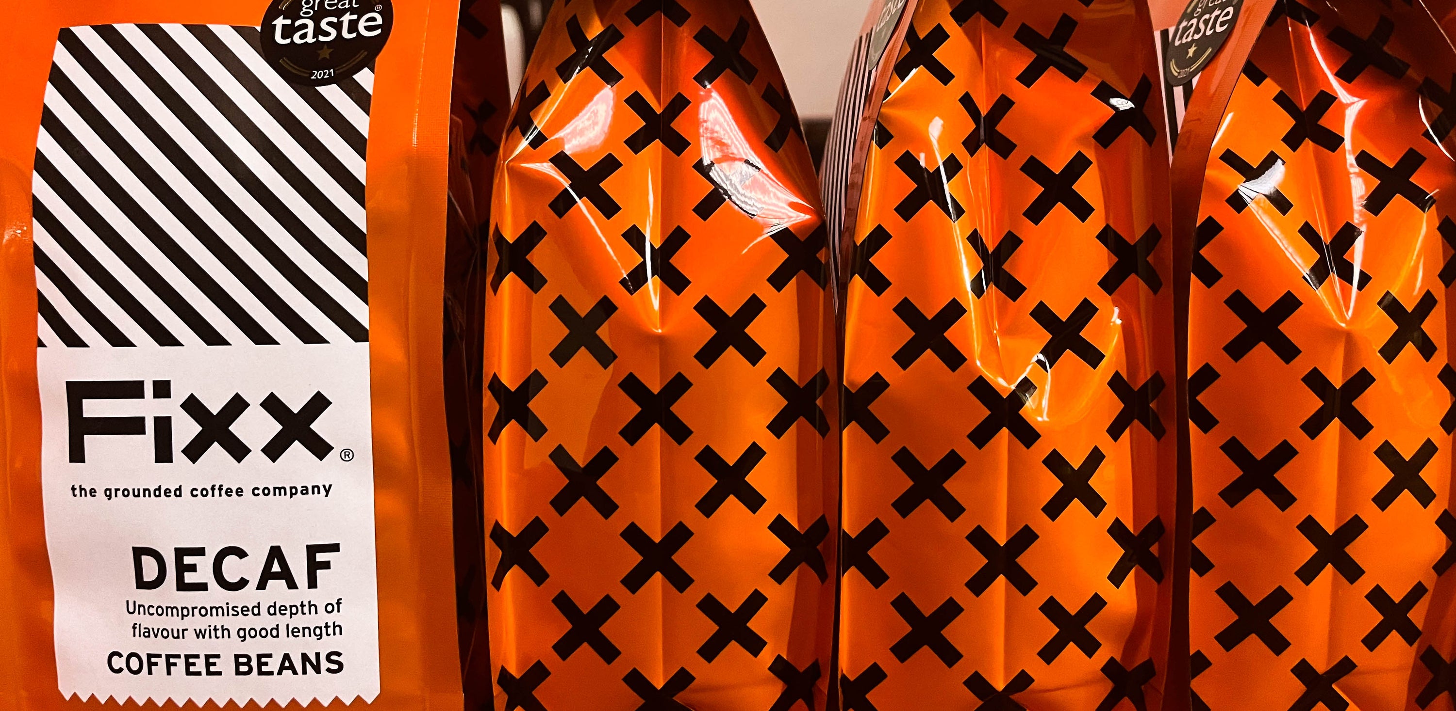 Orange bags of FiXX Decaf