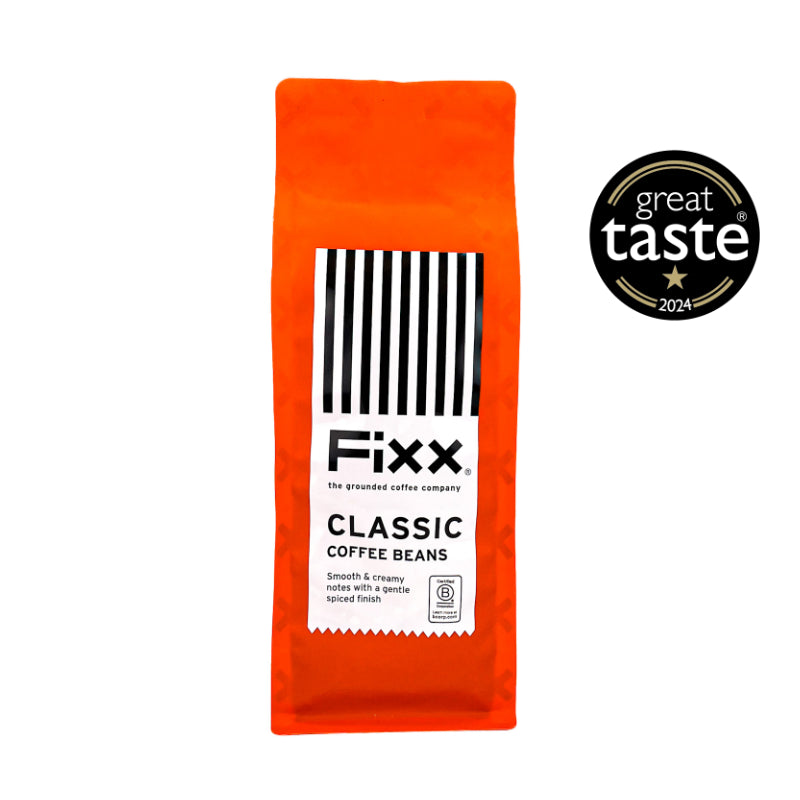Orange package of Fixx Classic Coffee Beans with Great Taste 2024 award on a white background