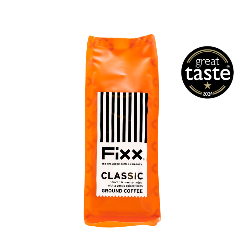 An orange bag of FiXX coffee on a white background with a Great Taste Award logo.