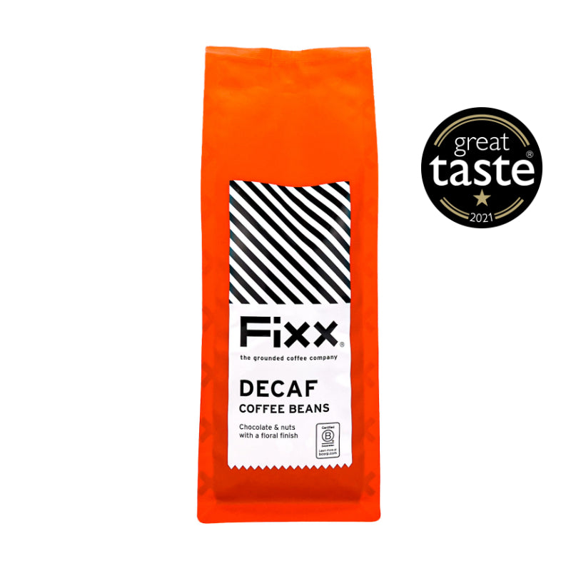 Orange package of Fixx Decaf Coffee Beans with Great Taste Award logo on a white background