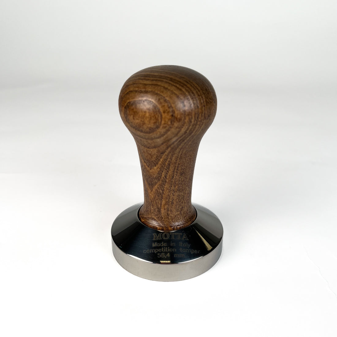 A stainless steel coffee tamper with a wooden handle, featuring a 58.4mm base diameter.