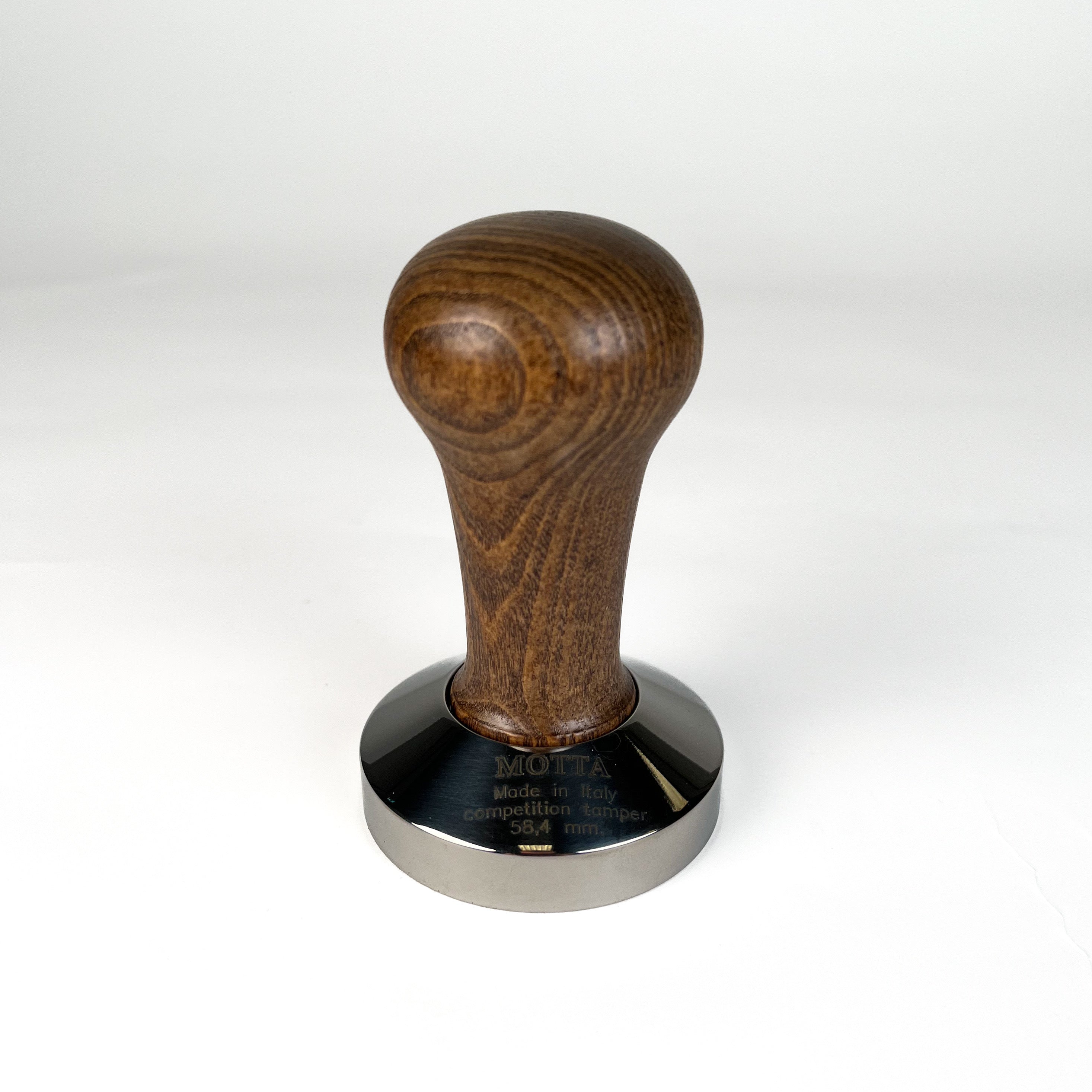 A stainless steel coffee tamper with a wooden handle, featuring a 58.4mm base diameter.
