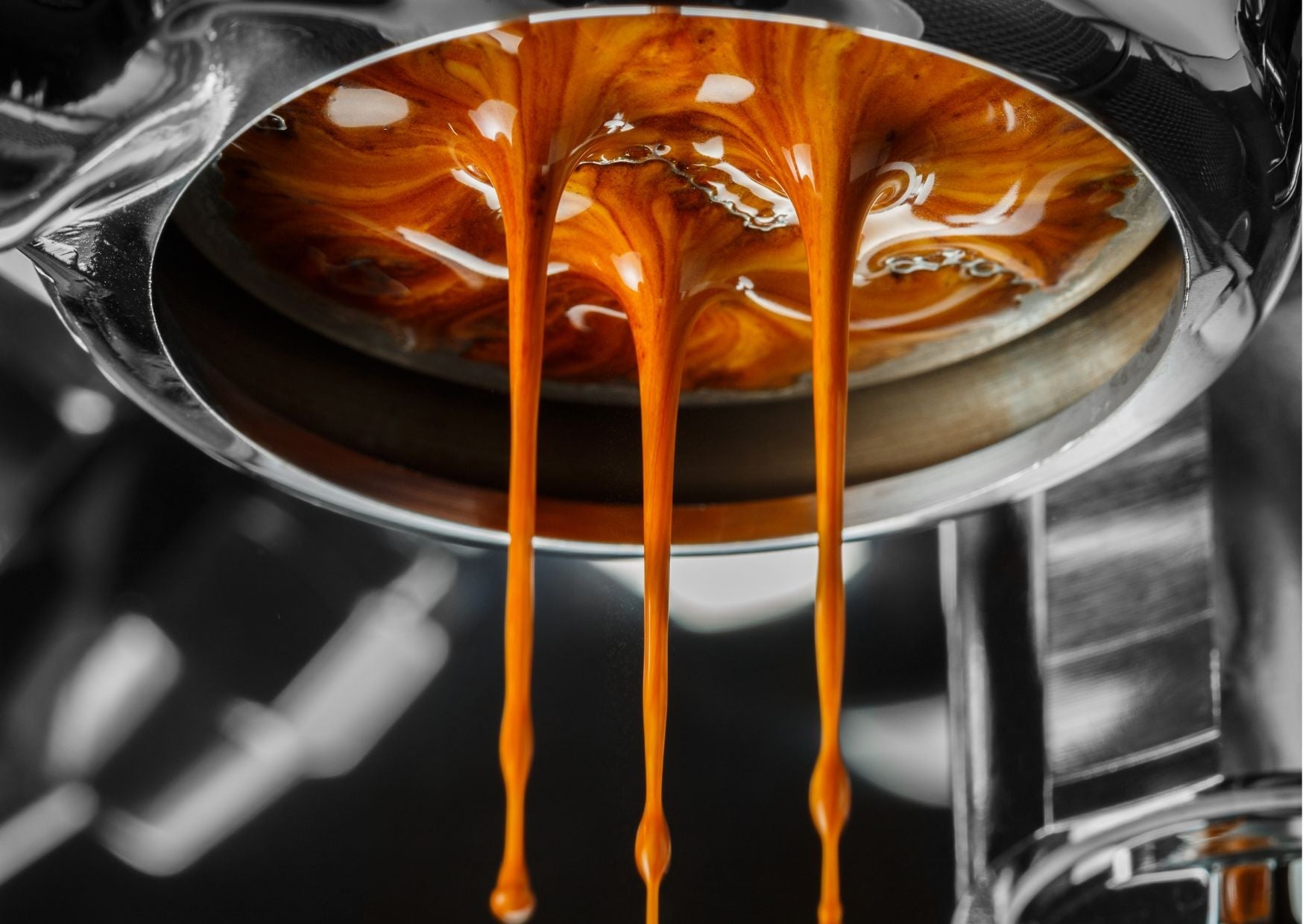 Espresso pouring from a naked portafilter