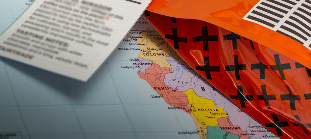 An orange bag of fixx coffee on a map of Colombia