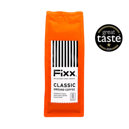 Orange package of Fixx Classic Ground Coffee with Great Taste 2024 award on a white background
