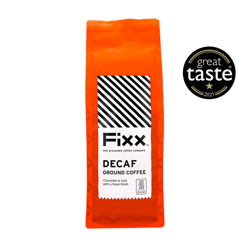 Orange package of Fixx Decaf Ground Coffee with Great Taste Award logo on a white background
