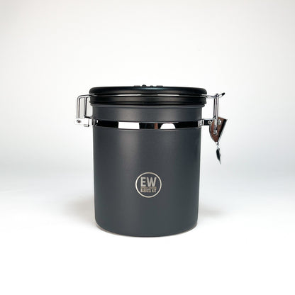 Black airtight container with a lid on a white background