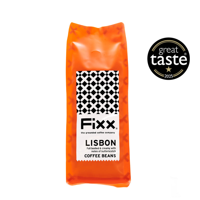 Orange package of Fixx Lisbon coffee beans with a Great Taste award logo on a white background