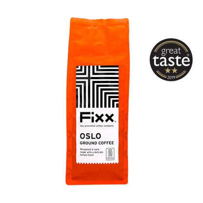 Orange package of Fixx Oslo Ground Coffee with Great Taste award logo on a white background