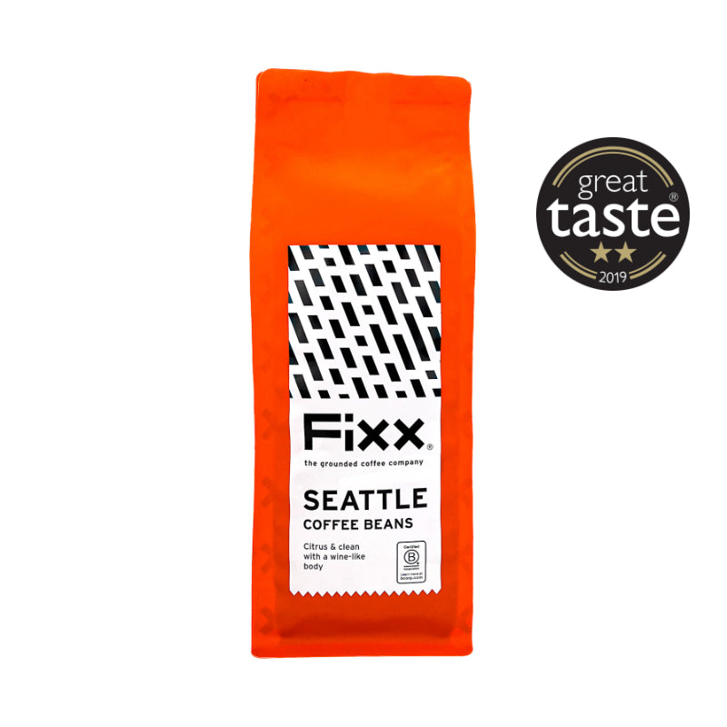 Orange package of Fixx Seattle Coffee Beans with a Great Taste award badge on a white background