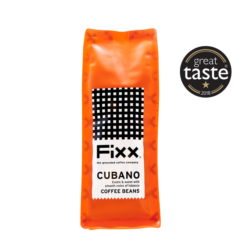 An orange bag of FiXX Cubano coffee beans on a white background with a Great Taste Award logo.